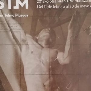 May include: A black and white poster advertising an exhibition of photographs by Josep M. Sert at the San Telmo Museum in Donostia-San Sebastián, Spain. The poster features a photograph of a nude male figure, and the text "Modeloaren argazki artxiboa" (The photographic archive of the model) in Basque.