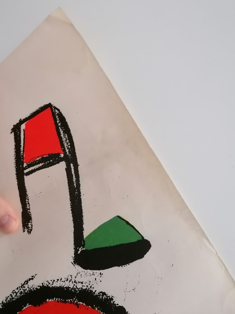 May include: A black and white abstract art print with a red and green musical note. The note is outlined in black and filled in with red and green.
