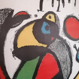 May include: Abstract art print featuring a black, yellow, red, green, and blue design. The print has a textured, hand-painted look.
