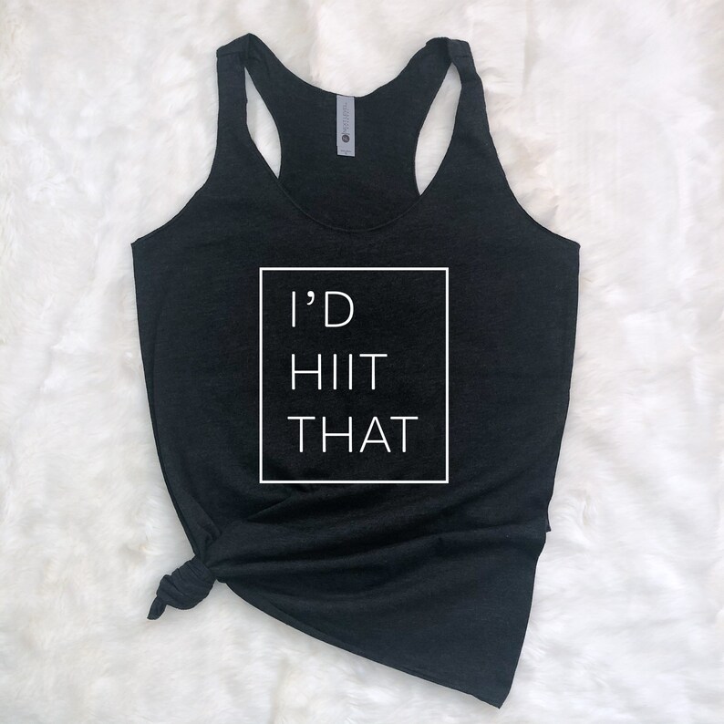 May include: Black tank top with a white box and the text "I'D HIIT THAT" printed on the front.