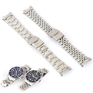 May include: Silver stainless steel watch bands with a folding clasp, alongside two wristwatches with blue and black dials. The watch bands are shown in two different styles, one with a square link design and the other with a more rounded link design.