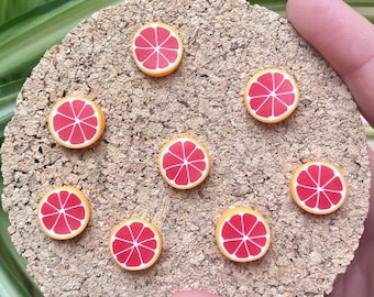 Magneti a fetta di arancia rossa o puntine da disegno
