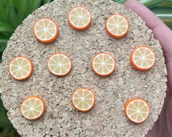Ímãs ou tachinhas em formato de fatia de laranja