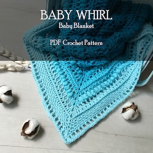 May include: A blue and teal crochet baby blanket with a lacy pattern. The blanket is folded and draped over a white metal basket. The text "BABY WHIRL Baby Blanket PDF Crochet Pattern" is visible on the image.