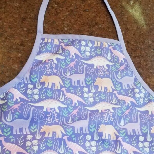 Cute dinosaurs on lavender, pink and peach - children's sized cotton apron