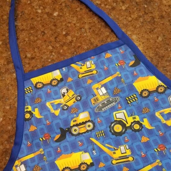 Construction trucks!  Bright gold trucks and diggers - child sized apron.