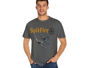 May include: A charcoal gray t-shirt with a graphic of two vintage fighter jets flying in formation. The text "SpitFire" is printed in yellow above the jets, with a target symbol to the right of the text.