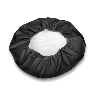 May include: A circular shower cap featuring a solid black outer fabric with a gathered elastic edge and a contrasting white inner lining. The design is simple and functional, with a pleated texture created by the elastic band around the opening.