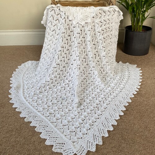 Baby shawl/ blanket hand knitted in a delicate but pretty textured lace design - 38” x 38” approx (97cms x 97 cms approx)