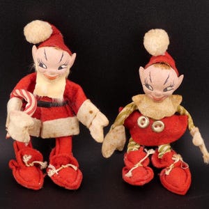 May include: A set of three ceramic nesting bowls in shades of blue, green, and white. The bowls feature a speckled glaze and a simple, modern design. The largest bowl measures approximately 6 inches in diameter.