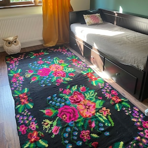 Gorgeous floral Moldavian rug handwoven in wool, black background with colorful flowers