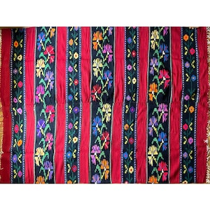 Romanian wool rug, red background with delicate colourful flowers