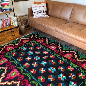 Vintage wool handmade rug with floral and geometrical design