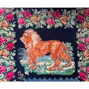 Large antique rug with a majestic lion and floral decor