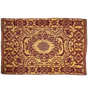 Romanian vintage carpet brown floral design on a yellow background