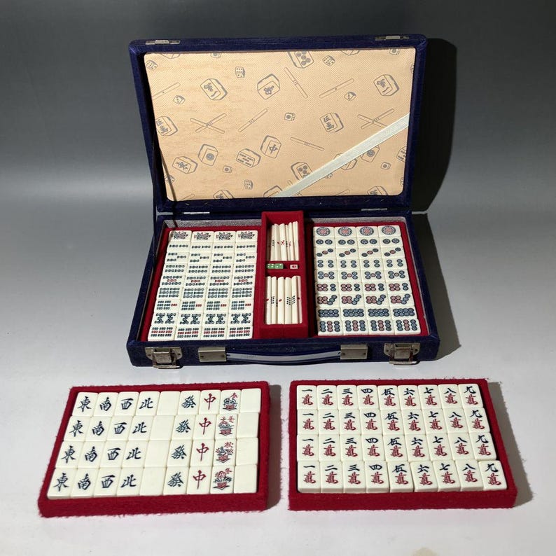 a mahjong game set in a grey room