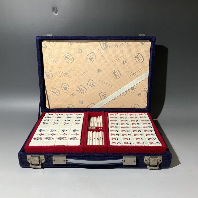 a mahjong game set in a grey room