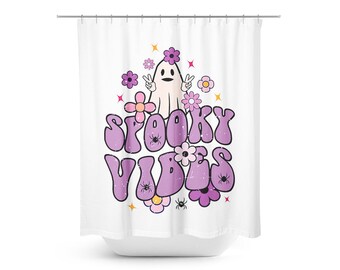May include: A white shower curtain with a purple and pink design featuring a ghost with a friendly face, flowers, and the text "Spooky Vibes".