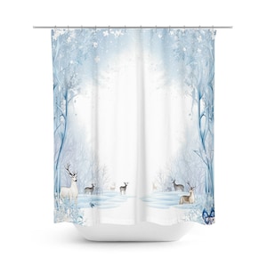 May include: A blue and white shower curtain with a winter forest scene. The scene features a snowy forest with trees and deer. A blue butterfly is in the bottom right corner.