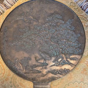 Antique Japanese Kagami - Bronze Antique Hand Mirror - Flying Cranes Turtle, Pine Trees, Pond Theme Meiji or Taishō Period 1868-1926
This piece roughly from the Meiji period (1868-1921) or Taisho period (1921-1926) is a Japanese bronze