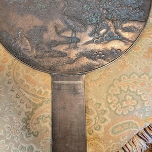 Antique Japanese Kagami - Bronze Antique Hand Mirror - Flying Cranes Turtle, Pine Trees, Pond Theme Meiji or Taishō Period 1868-1926
This piece roughly from the Meiji period (1868-1921) or Taisho period (1921-1926) is a Japanese bronze