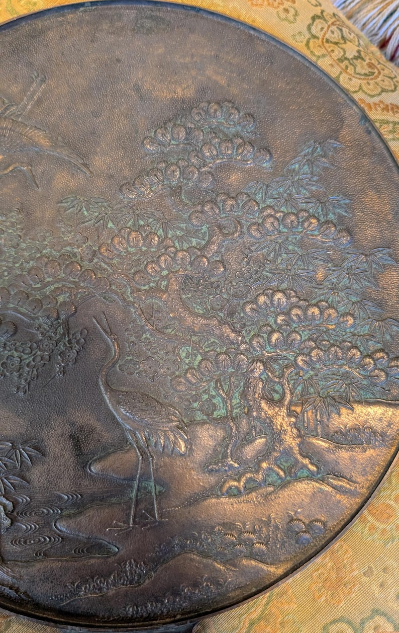 Antique Japanese Kagami - Bronze Antique Hand Mirror - Flying Cranes Turtle, Pine Trees, Pond Theme Meiji or Taishō Period 1868-1926
This piece roughly from the Meiji period (1868-1921) or Taisho period (1921-1926) is a Japanese bronze