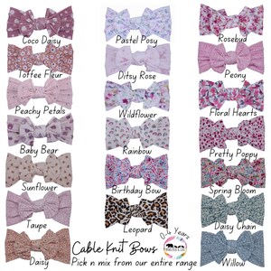 May include: A collection of 15 cable knit hair bows in various colors and patterns, including floral, animal print, and solid colors. The bows are arranged in three rows of five, with the text "Cable Knit Bows" and "Pick n mix from our entire range" at the bottom.