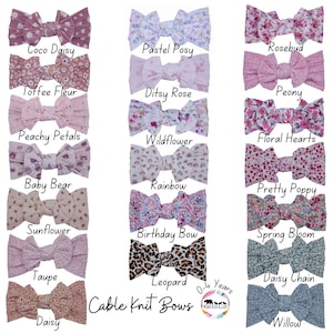 May include: A collection of 16 cable knit hair bows in various colors and patterns, including floral, leopard, and rainbow prints. The bows are arranged in four rows of four, with the text "Cable Knit Bows" and "0-4 Years" printed below the bows.