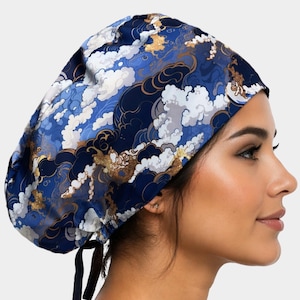 May include: A blue, white, and gold patterned scrub cap. The cap features a cloud-like design with gold accents. The cap is tied in the back with black ties.