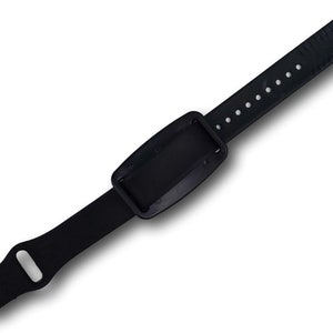 A view of the back of a nvs magnet on a black silicone band.
