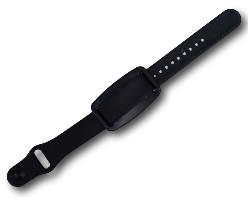 A view of the back of a nvs magnet on a black silicone band.