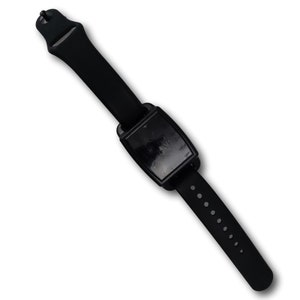 Looking down on a black vans magnetic on a black silicone band.
