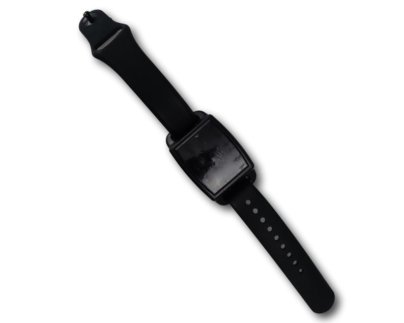 Looking down on a black vans magnetic on a black silicone band.