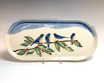 Ceramic oval plate with four birds.
