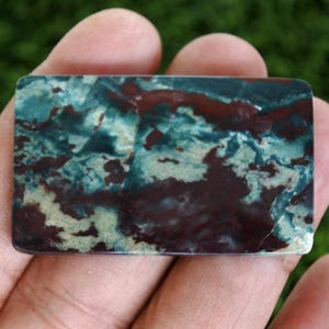 May include: A set of three ceramic mugs with a speckled, matte finish. The mugs are in shades of cream, light gray, and dark gray. Each mug has a simple, minimalist design, perfect for coffee or tea.