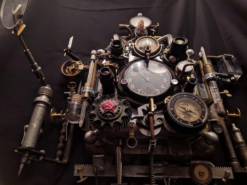 May include: A steampunk-style clock with a compass, gears, and other intricate details. The clock face has Roman numerals and a red star.