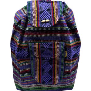 May include: A purple and multi-colored woven backpack with a flap closure and two front pockets. The backpack has a unique striped pattern and is made of a soft, durable fabric.