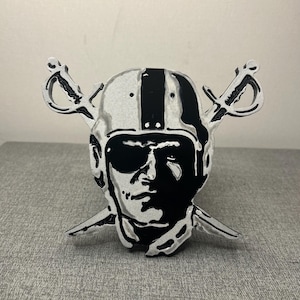 Raiders aluminum tow hitch cover.