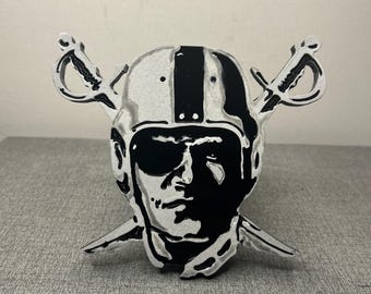 Raiders aluminum tow hitch cover.