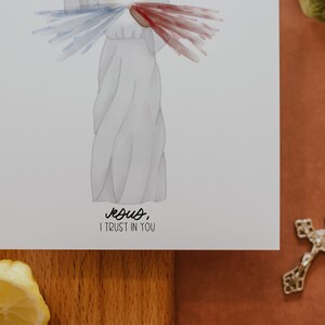 May include: A white watercolor illustration of Jesus with a red and blue heart above his head. The text below reads "Jesus, I trust in you".