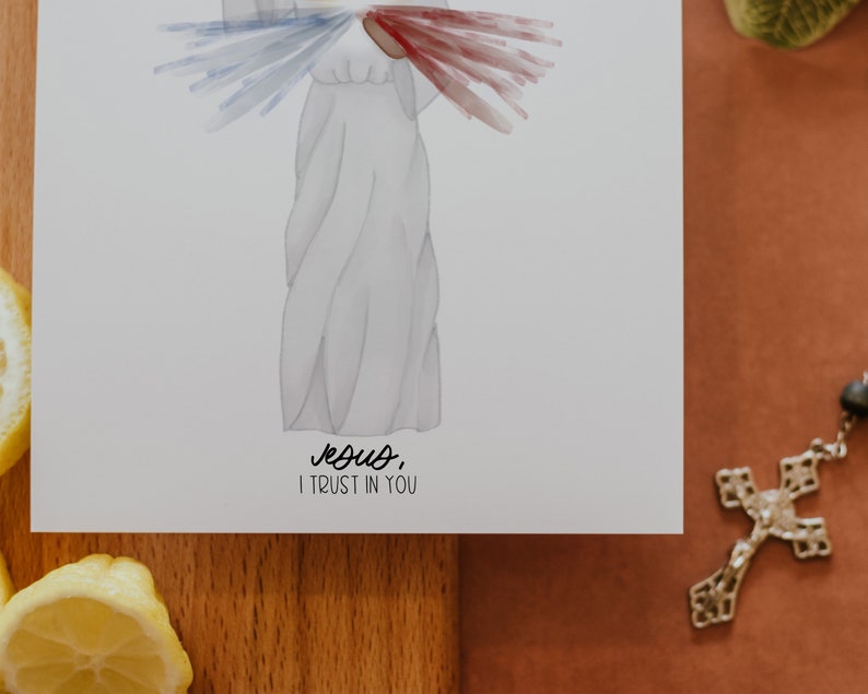 May include: A white watercolor illustration of Jesus with a red and blue heart above his head. The text below reads "Jesus, I trust in you".