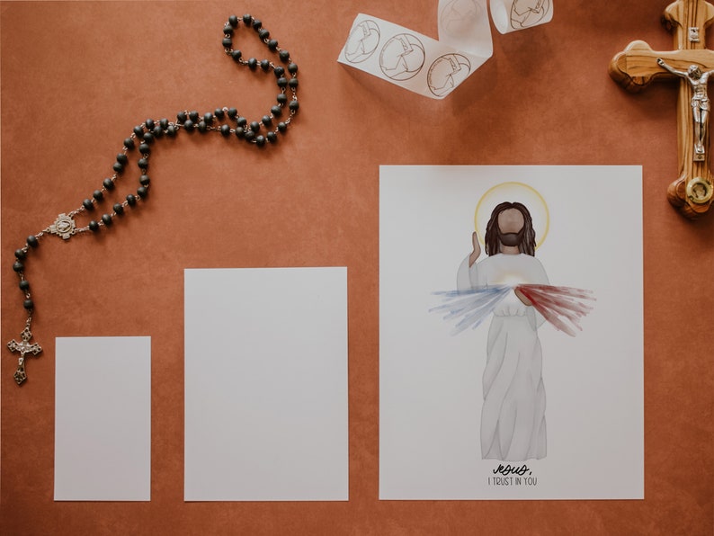 May include: A white card with a watercolor illustration of Jesus Christ with a red and blue heart on his chest. The text "Jesus, I trust in you" is written below the image.
