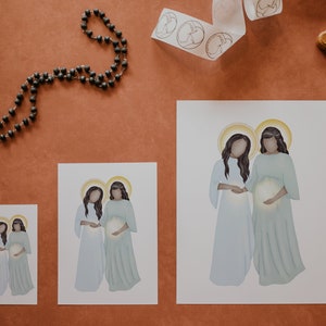 May include: Three different sizes of prints featuring a digital illustration of two women in white and blue robes, holding a glowing orb. The women have dark hair and are standing side-by-side.