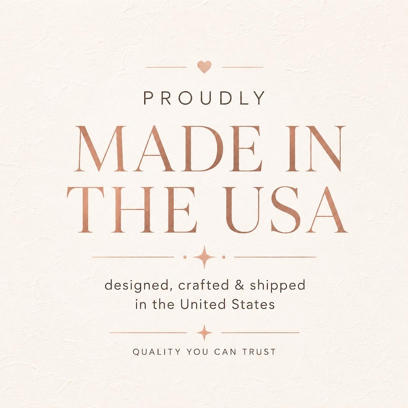 May include: A square graphic with a light cream textured background featuring rose gold text that reads PROUDLY MADE IN THE USA, with a small heart icon above and the text designed, crafted & shipped in the United States and QUALITY YOU CAN TRUST.