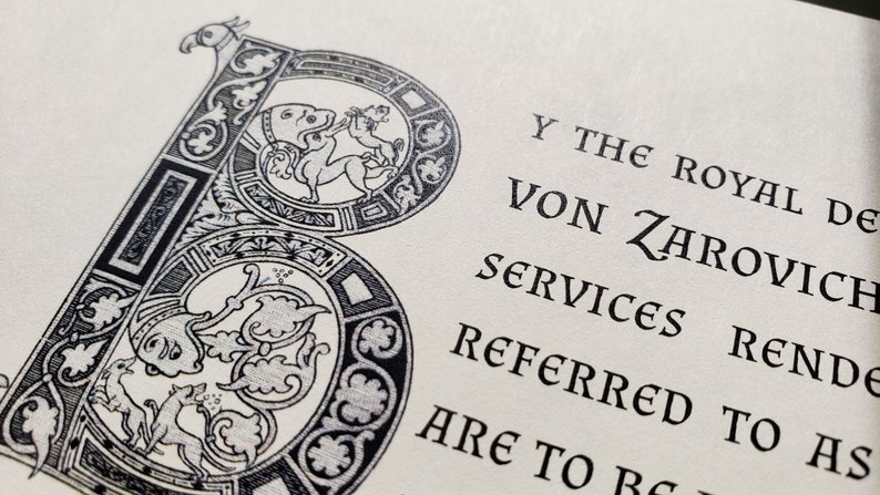 May include: A black and white illustration of a decorative letter B with intricate details. The text "Y THE ROYAL DE VON ZAROVICH SERVICES RENDERED TO AS ARE TO BE" is visible below the letter.