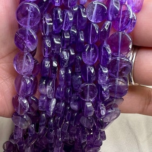 Natural purple amethyst beads organic round shape approx. 9-10mm smooth both sides, 14 inch strands. Varying size and color. 3 strands/order