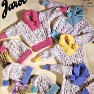 May include: A set of five knitted baby sweaters and hats in various colors, including pink, blue, yellow, and white. The sweaters feature a cable knit pattern and a contrasting color collar. The hats have a pom-pom on top. The sweaters are sized for 18-24 inches (46-66 cm).