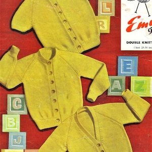 May include: Three yellow knitted cardigans with button closures. The cardigans are shown on a red background with alphabet blocks.