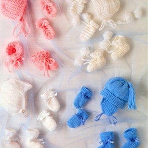 May include: A set of knitted baby hats and booties in pink, white and blue. The hats are all different styles, and the booties are all different sizes. The items are arranged on a white background.
