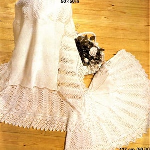 May include: Two white crocheted baby blankets, one square and one round. The square blanket measures 50 inches by 50 inches. The round blanket measures 50 inches in diameter. The blankets are made with a delicate lace pattern.